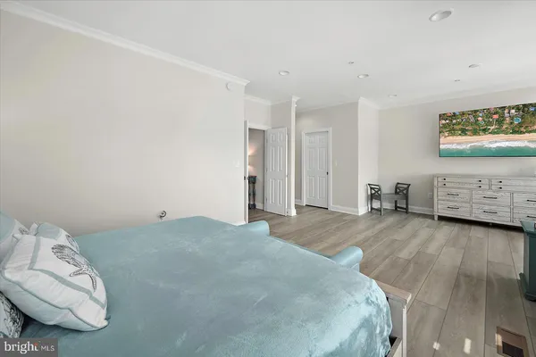 a bedroom with a bed and a couch