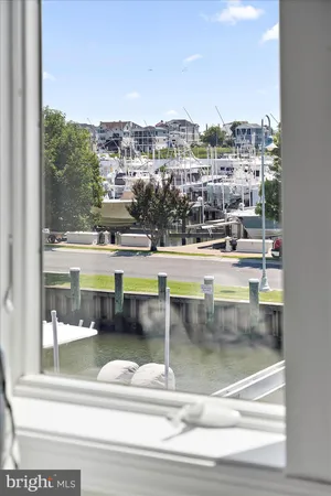a bathroom with a window a sink and a toilet