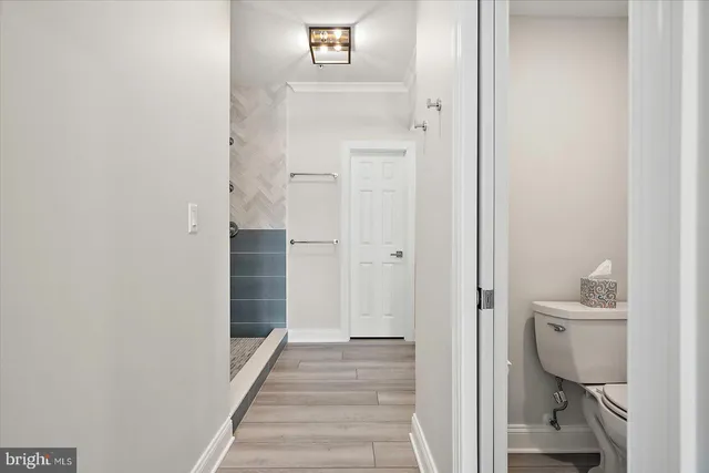 a view of a water fountain and a floor to ceiling window