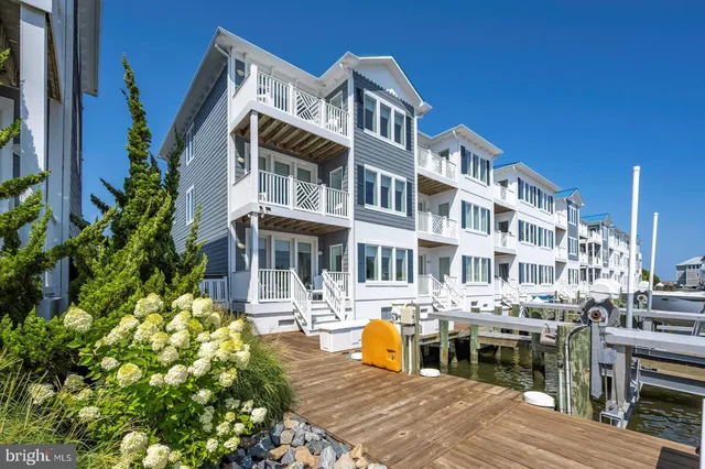 a living room with furniture a window and a glass door