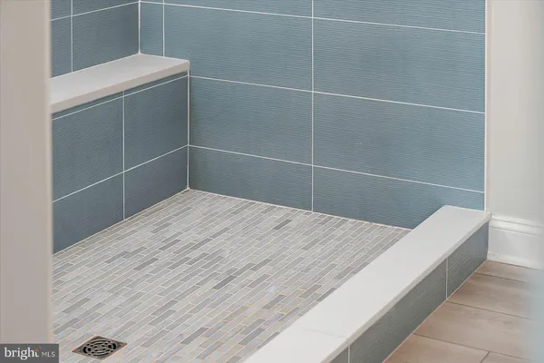 an aerial view of residential houses with outdoor space and lake view