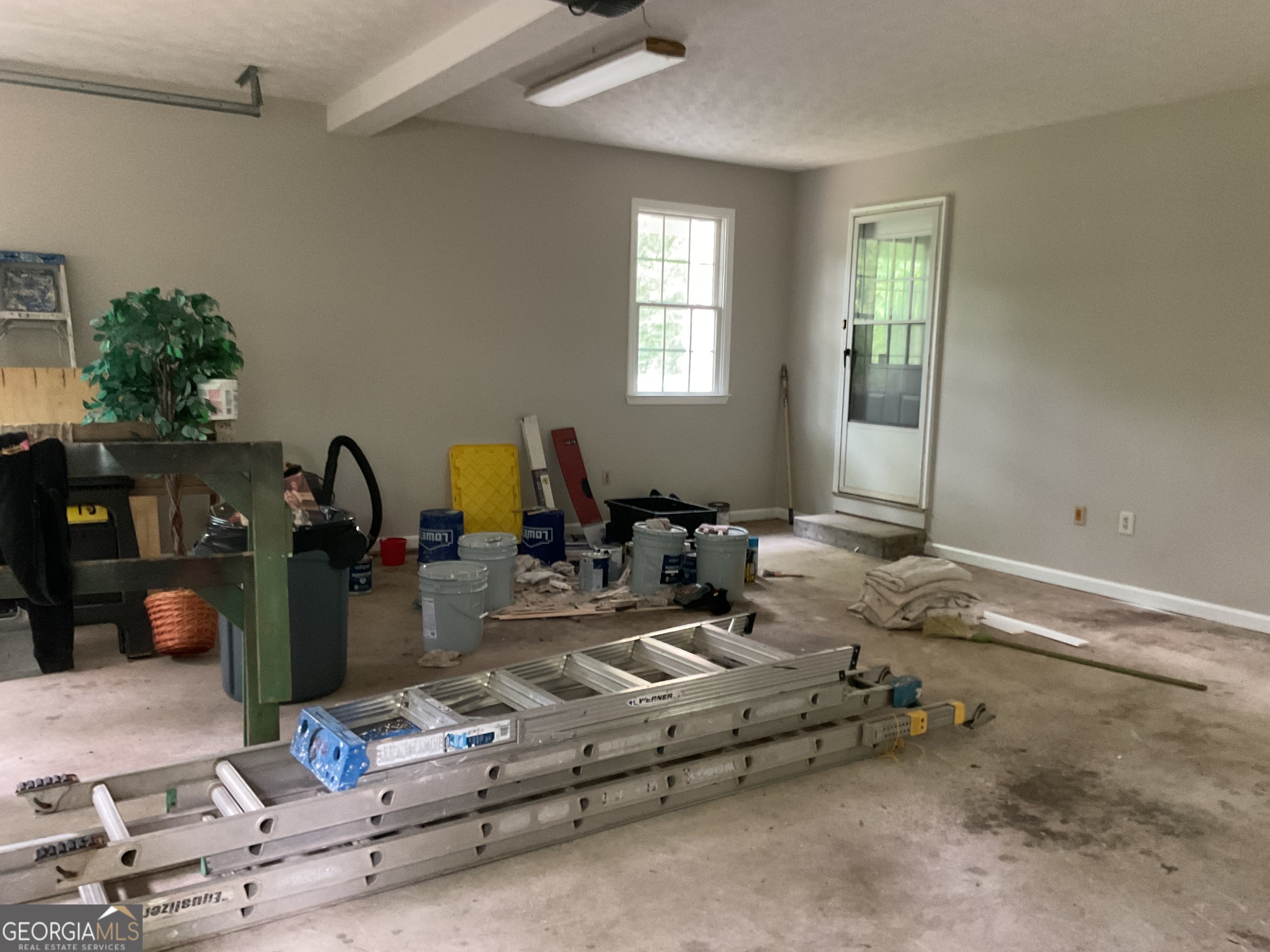 4800 Bethlehem Road Fairburn, GA 30213 - Photo 48 of 49 a room with gym equipment and a window
