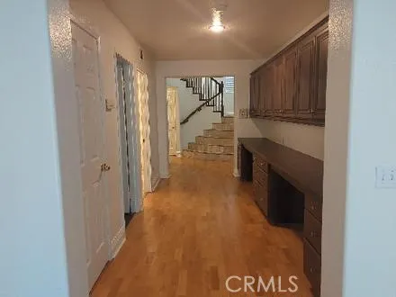 a bathroom with a tub a sink and mirror