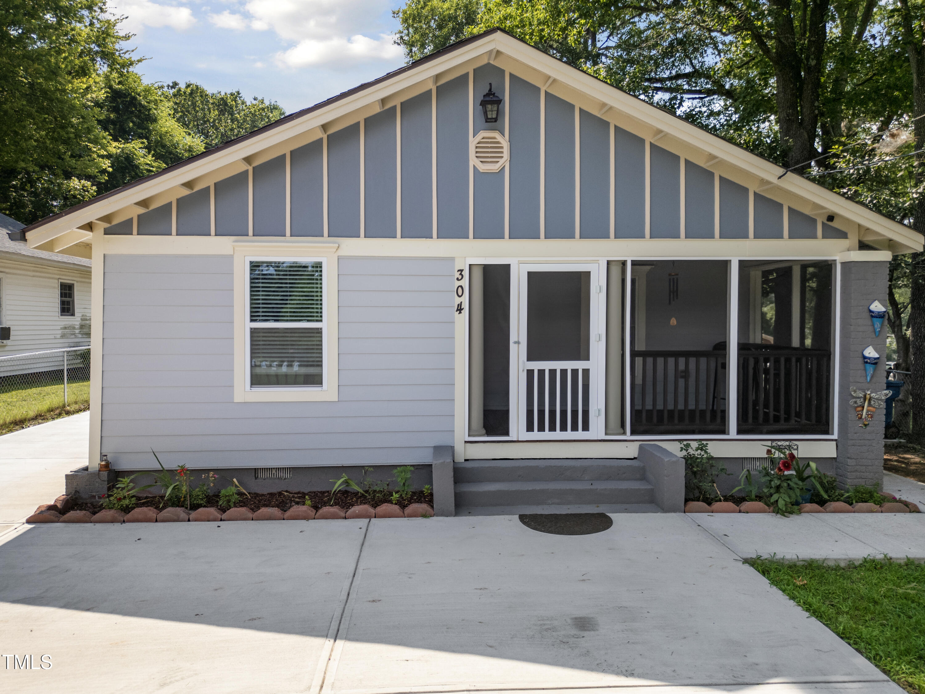 304 Spring Street Durham, NC 27703 - Photo 3 of 28 This charming home masterfully combines timeless appeal with modern comforts