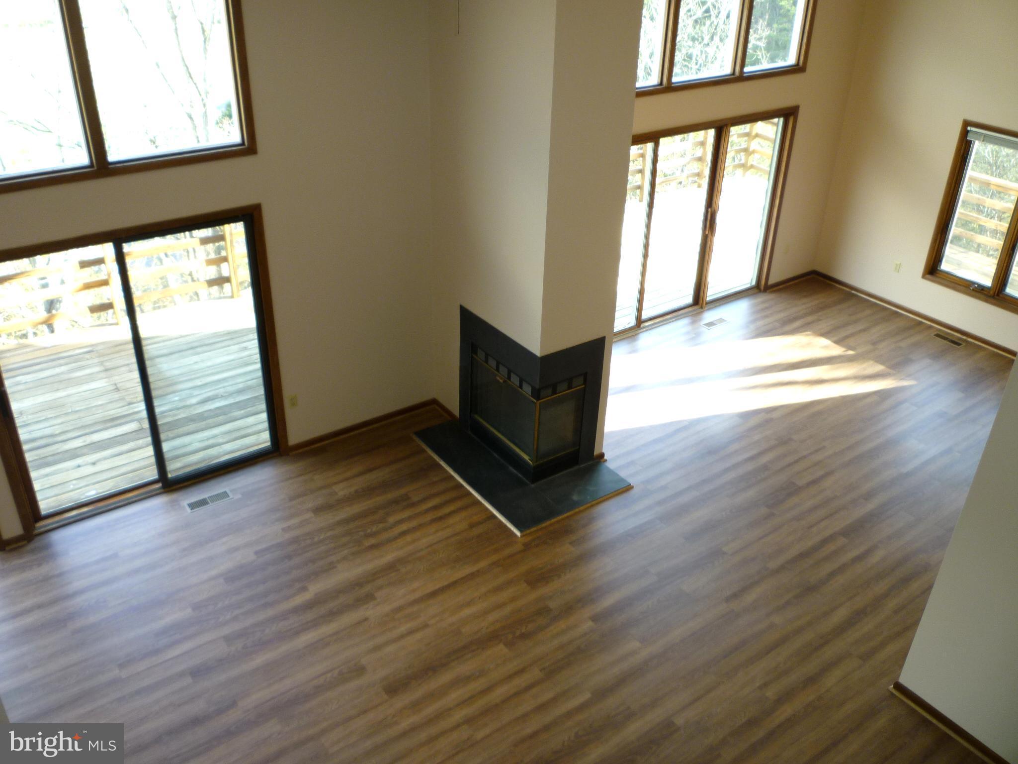 208 Hood's Point Road Basye, VA 22810 - Photo 11 of 27 Great room from the upper level balcony