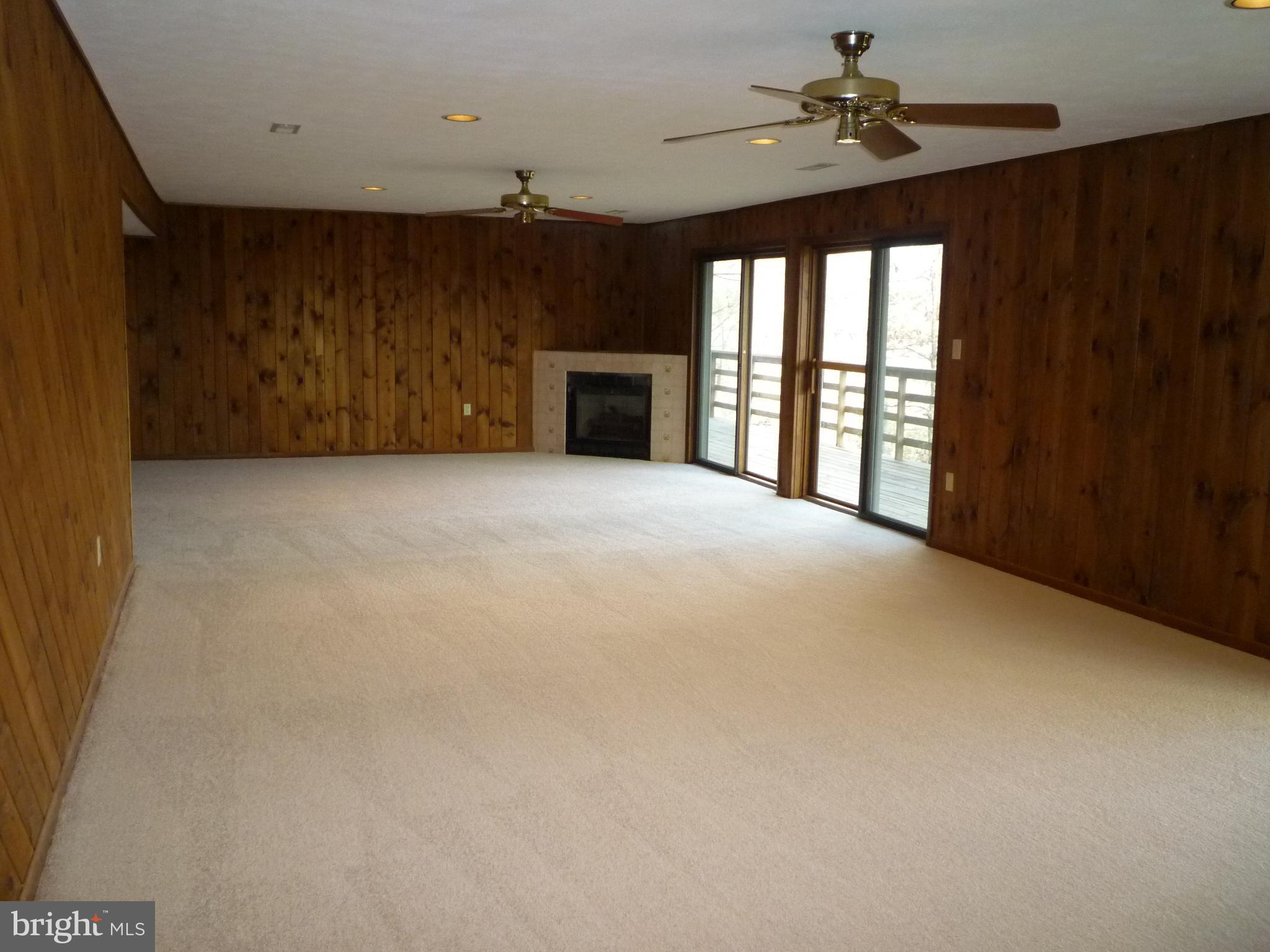 208 Hood's Point Road Basye, VA 22810 - Photo 23 of 27 Very large great room with gas fireplace