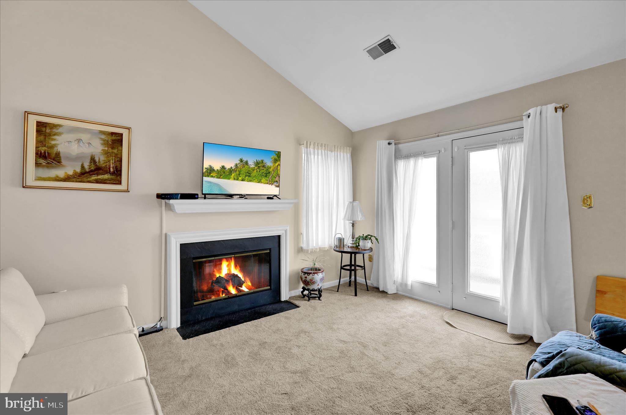 106 Heather Lane Reading, PA 19610 - Photo 5 of 23 a living room with furniture a fireplace and a flat screen tv