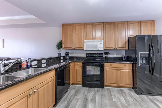 a room with furniture and wooden floor