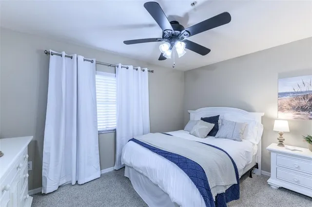 a hallway with mirror and cabinets