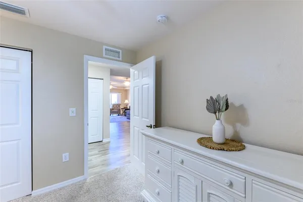 a kitchen with a refrigerator and a stove top oven