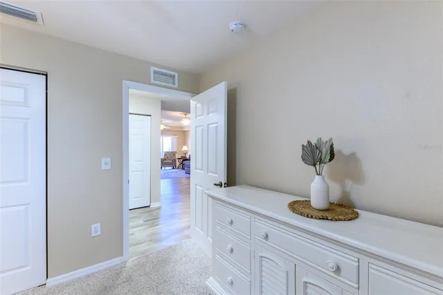 a kitchen with a refrigerator and a stove top oven