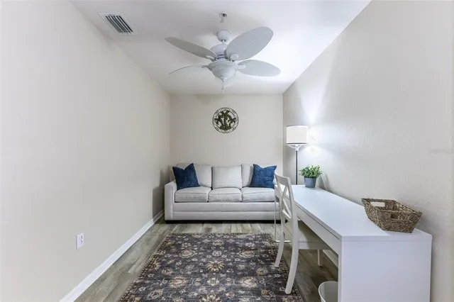 a dining room with furniture and wooden floor