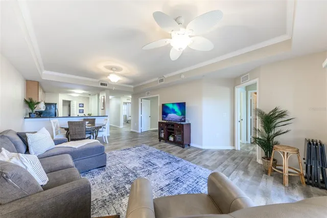 a bedroom with a bed and a large window with outer view
