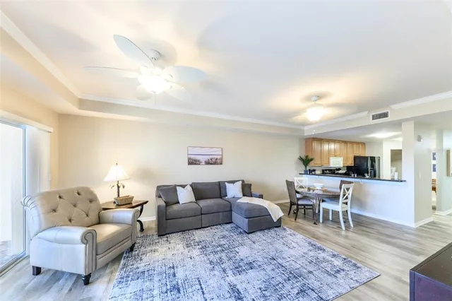 a view of a balcony with chair and floor to ceiling window