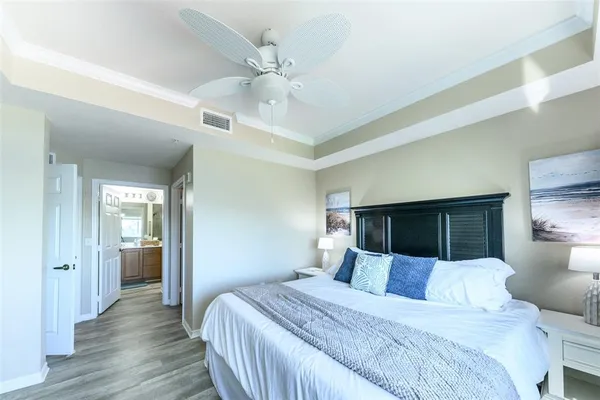 a bathroom with a granite countertop sink a toilet and a mirror