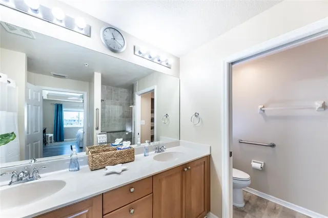 a balcony with wooden floor and outdoor seating