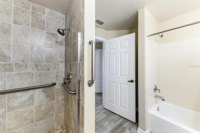 a view of a house with backyard porch and sitting area