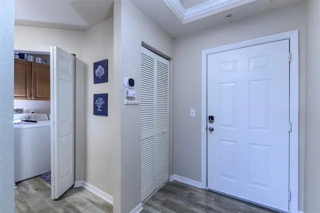 a kitchen with a refrigerator and a stove top oven