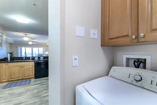 a kitchen with a refrigerator and a stove