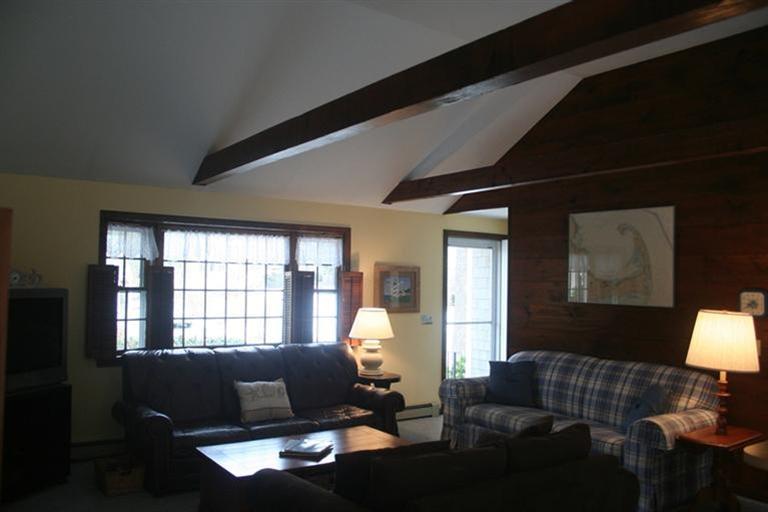 24 Eileen Road Chatham, MA 02633 - Photo 4 of 12 a living room with furniture and a lamp