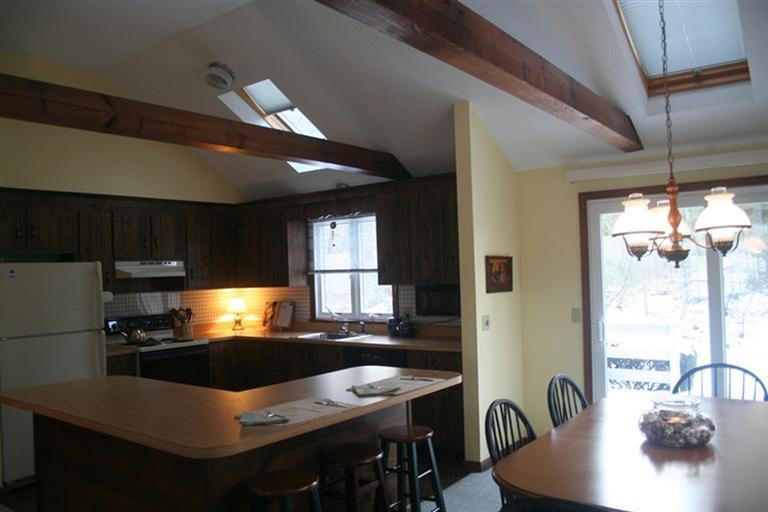 24 Eileen Road Chatham, MA 02633 - Photo 5 of 12 a kitchen with granite countertop a sink stainless steel appliances and cabinets