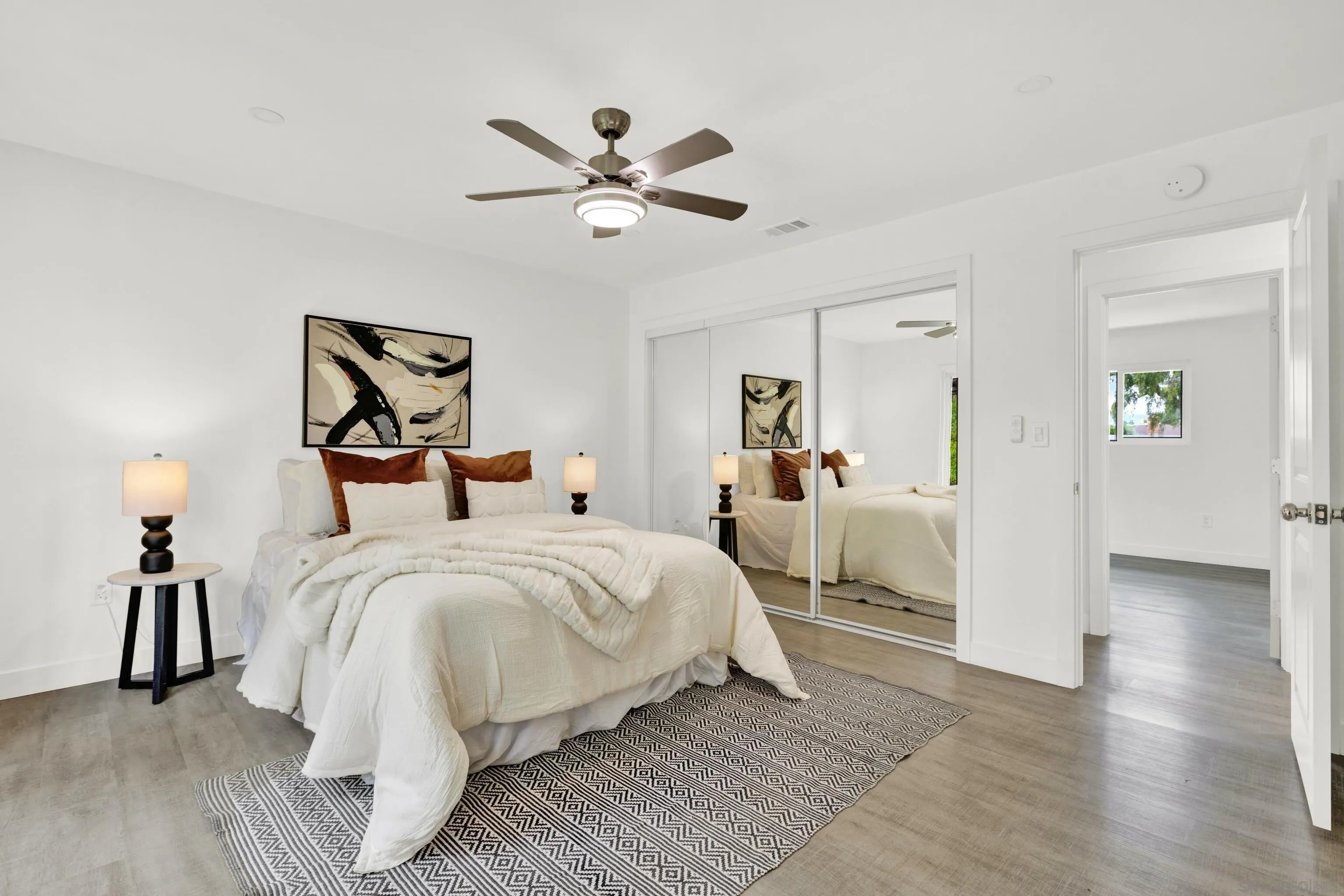 2250 Ivy Road Oceanside, CA 92054 - Photo 14 of 30 a bed room with a bed and a chandelier