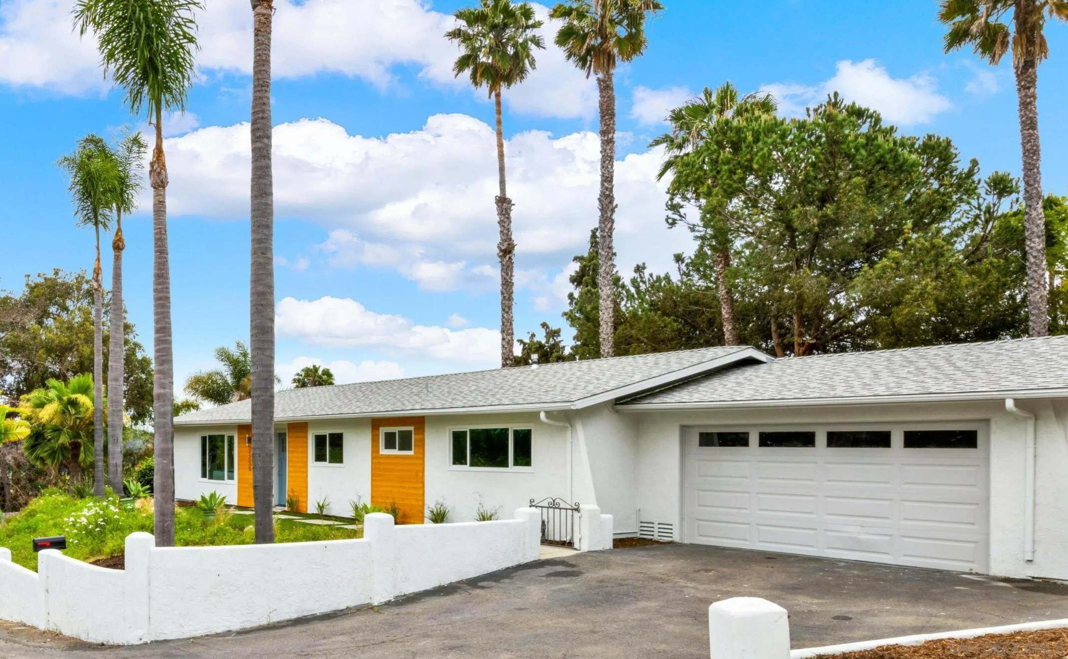 2250 Ivy Road Oceanside, CA 92054 - Photo 2 of 30 a front view of a house with a garden