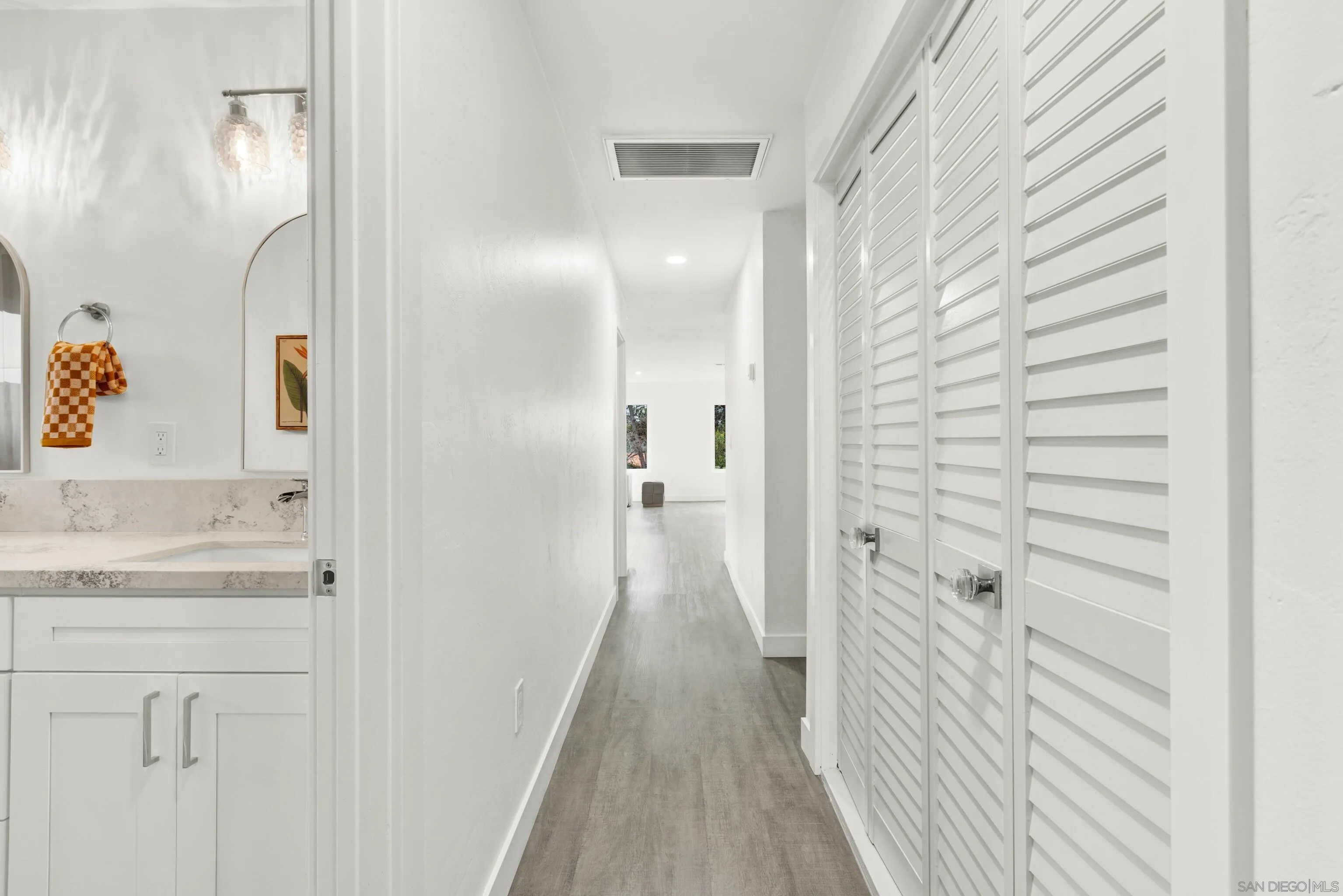 2250 Ivy Road Oceanside, CA 92054 - Photo 24 of 30 a view of a bathroom from a hallway