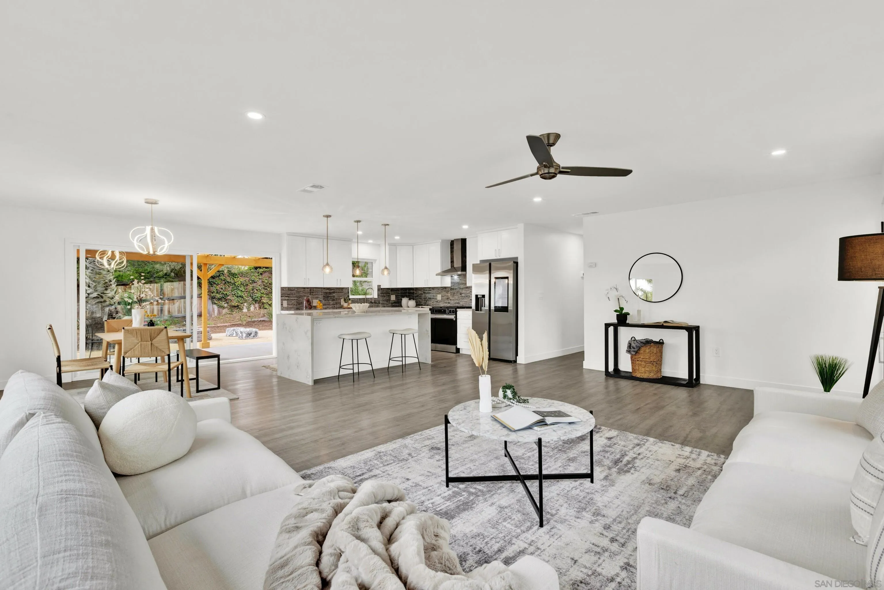 2250 Ivy Road Oceanside, CA 92054 - Photo 7 of 30 a living room with furniture kitchen view and a large window