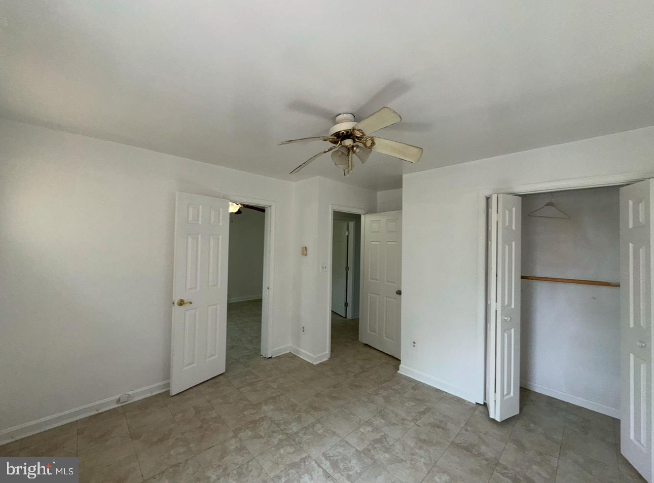 7341 Waldman Avenue Sparrows Point, MD 21219 - Photo 13 of 15 an empty room with a ceiling fan