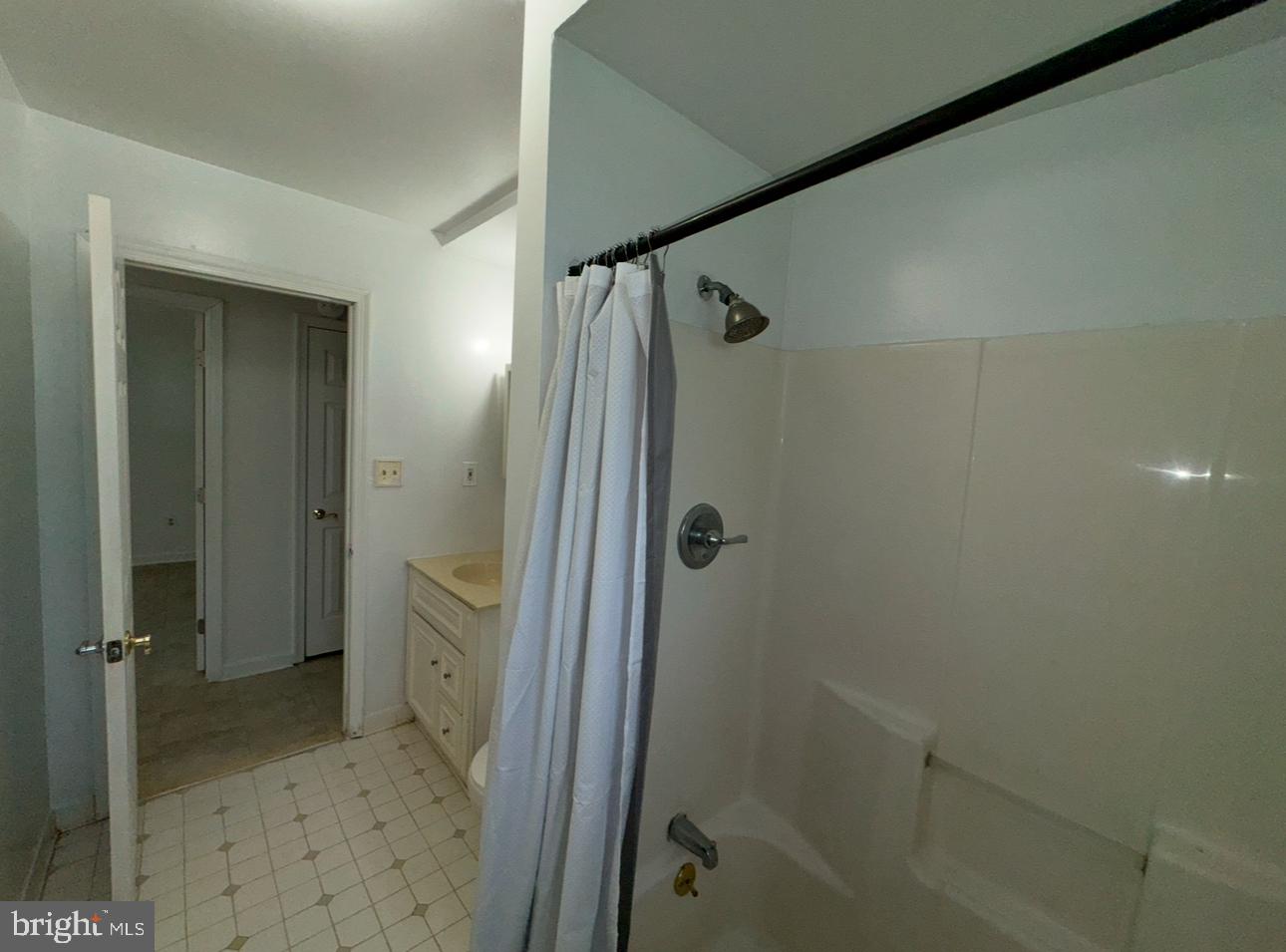 7341 Waldman Avenue Sparrows Point, MD 21219 - Photo 15 of 15 a bathroom with a shower and a sink