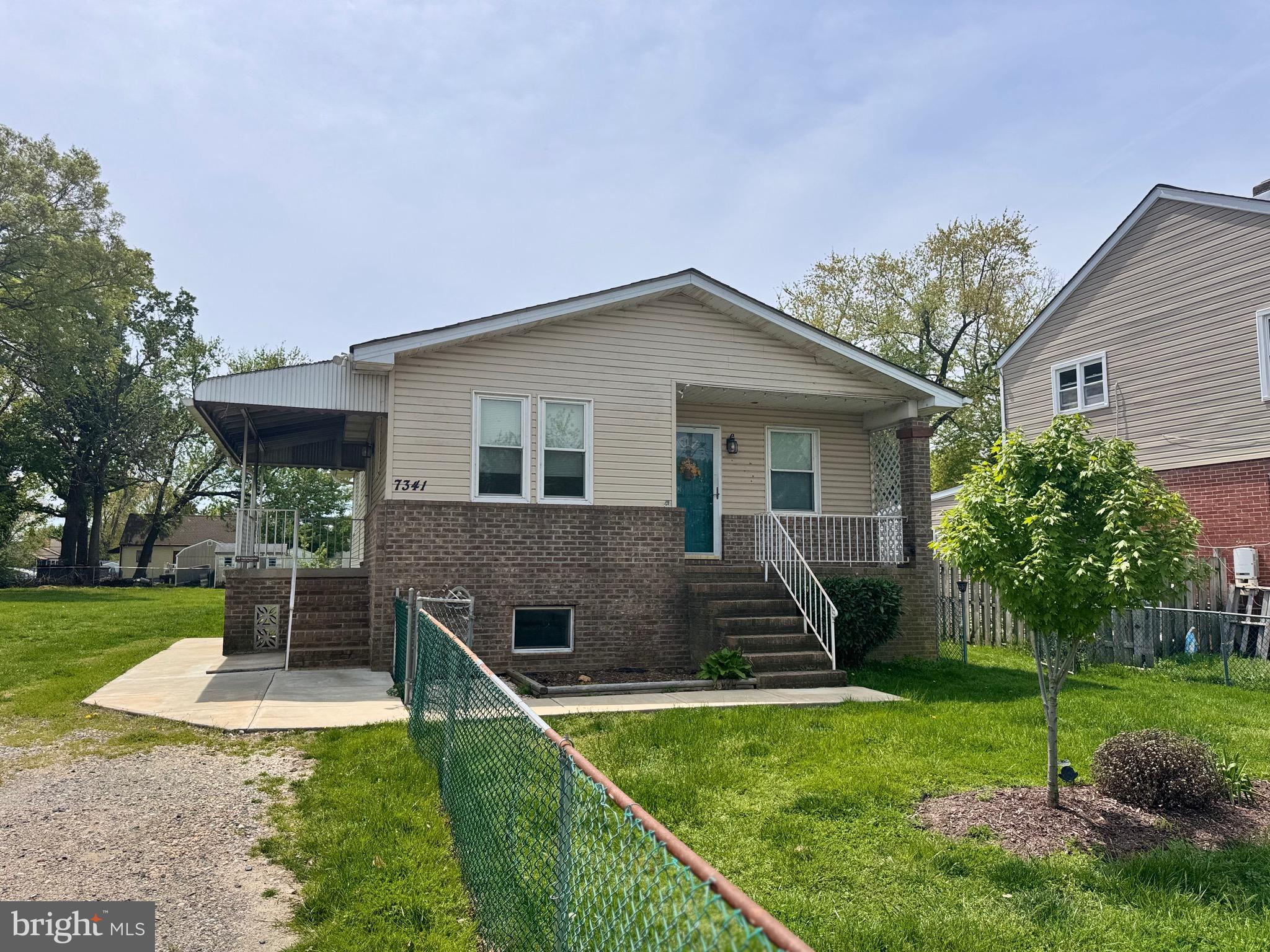 7341 Waldman Avenue Sparrows Point, MD 21219 - Photo 2 of 15 a front view of house with yard and green space
