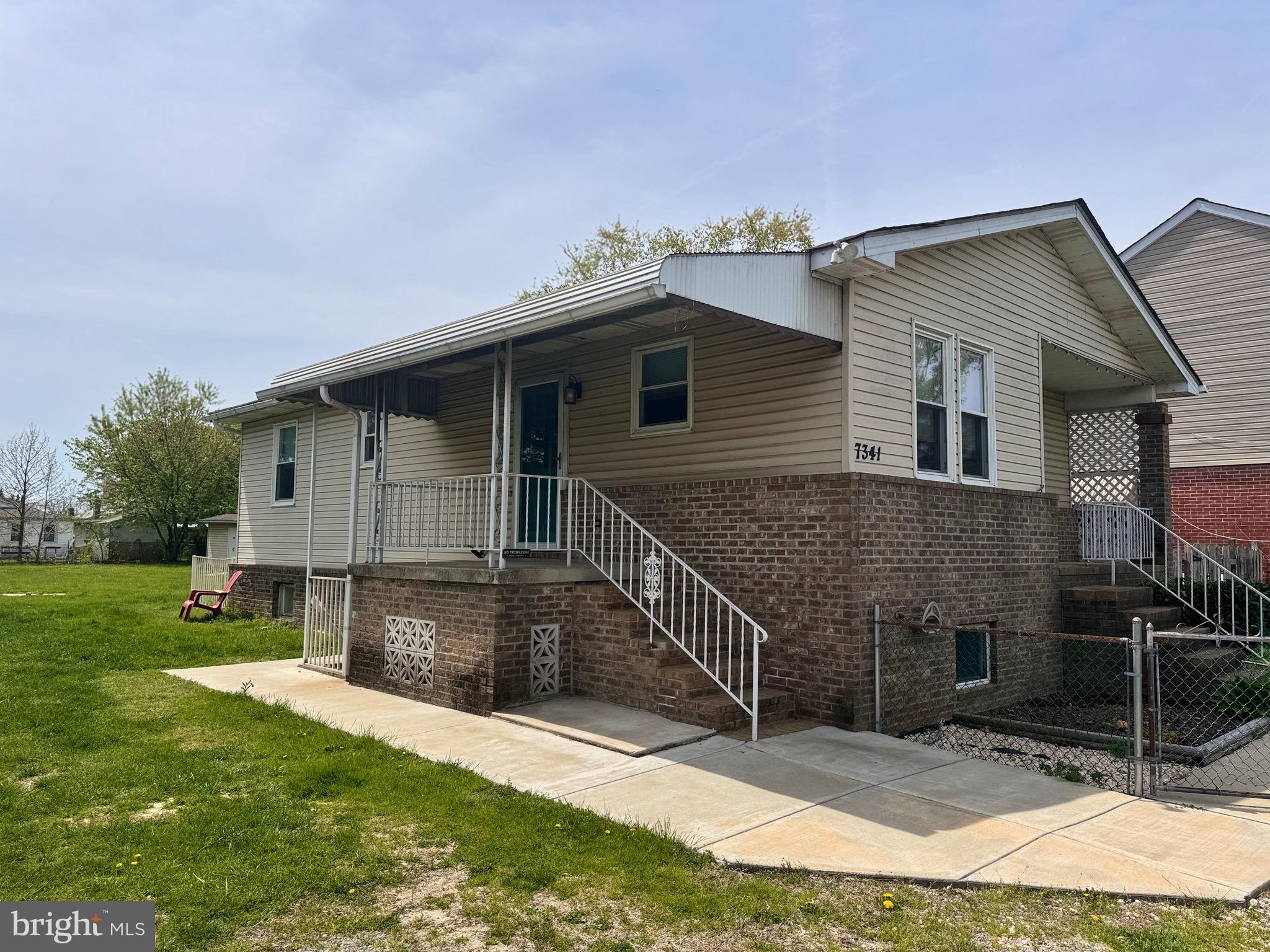 7341 Waldman Avenue Sparrows Point, MD 21219 - Photo 3 of 15 a view of a house with a yard