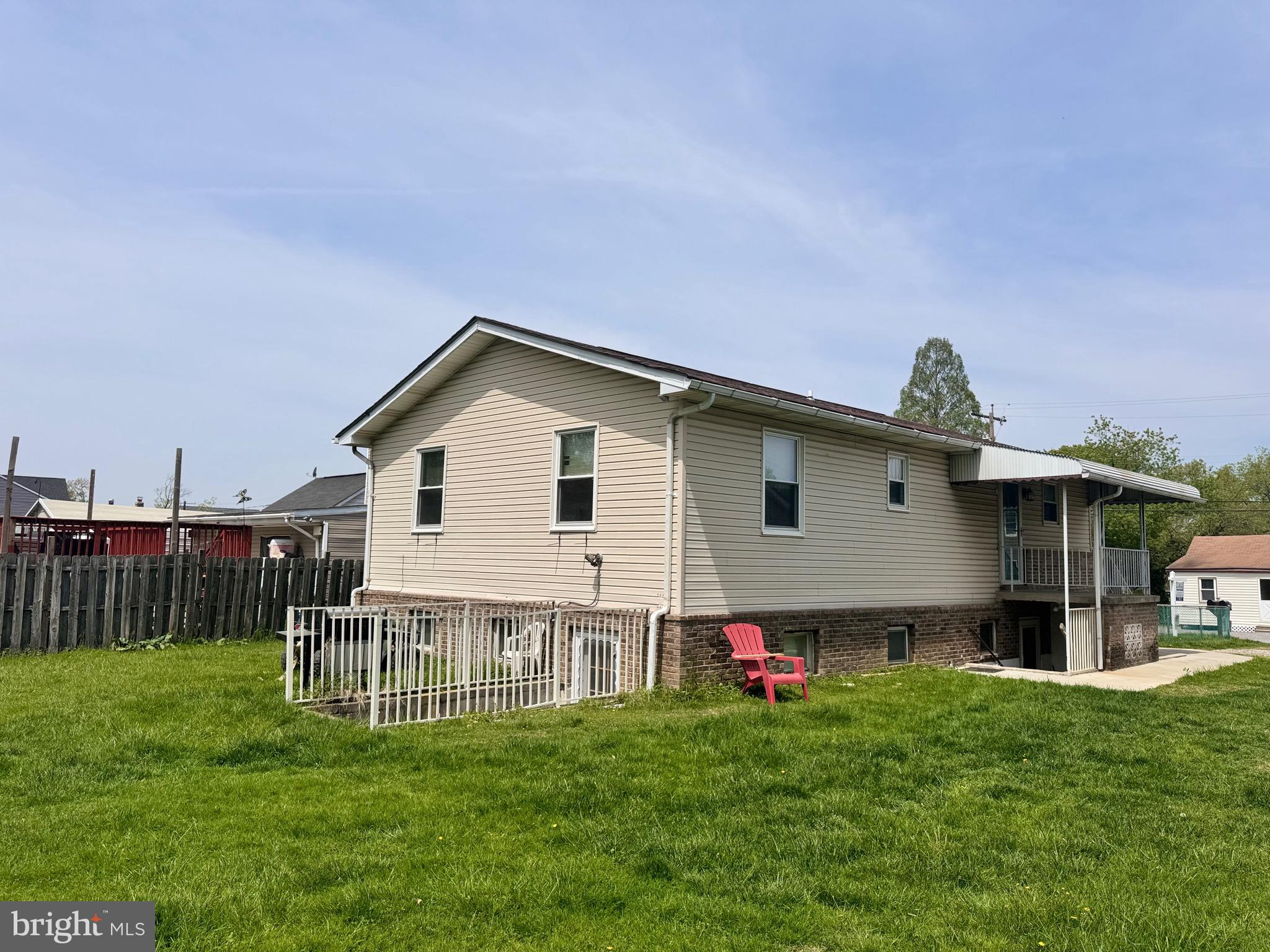 7341 Waldman Avenue Sparrows Point, MD 21219 - Photo 4 of 15 a backyard of a house with table and chairs