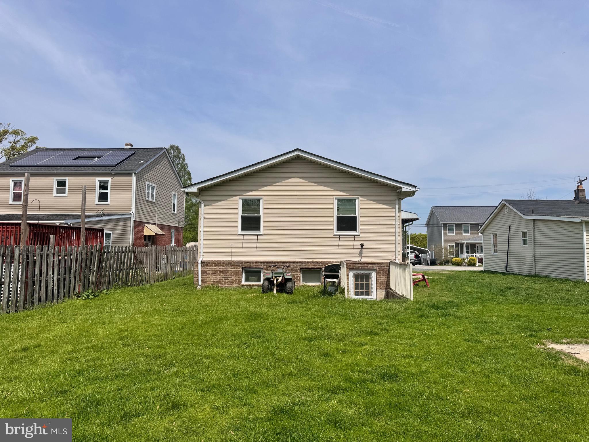 7341 Waldman Avenue Sparrows Point, MD 21219 - Photo 5 of 15 a view of a house with a yard and deck