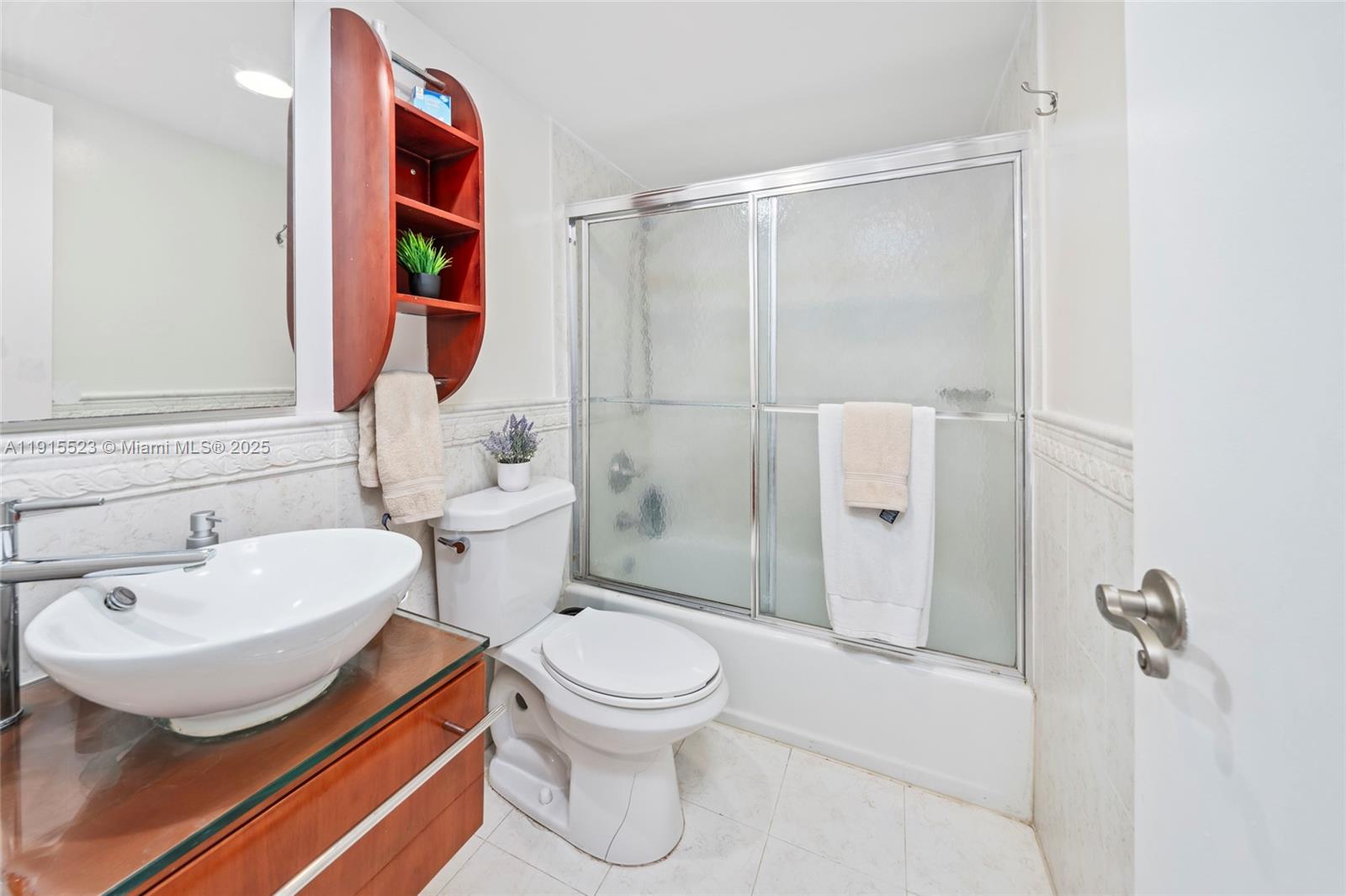 2100 Sans Souci Boulevard, Unit B1006 North Miami, FL 33181 - Photo 15 of 40 a bathroom with a sink toilet and shower