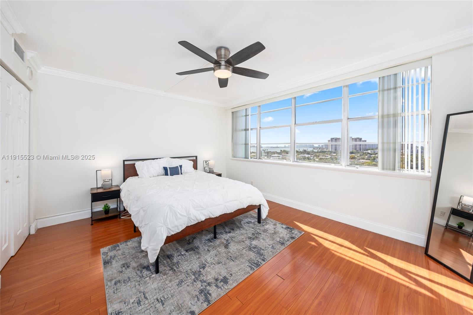 2100 Sans Souci Boulevard, Unit B1006 North Miami, FL 33181 - Photo 16 of 40 a bedroom with a bed and a window