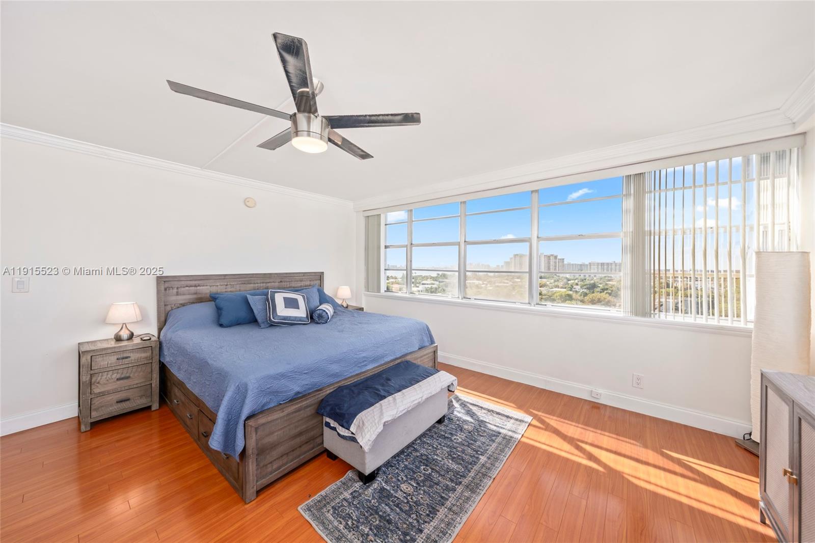 2100 Sans Souci Boulevard, Unit B1006 North Miami, FL 33181 - Photo 18 of 40 a bedroom with a bed and window