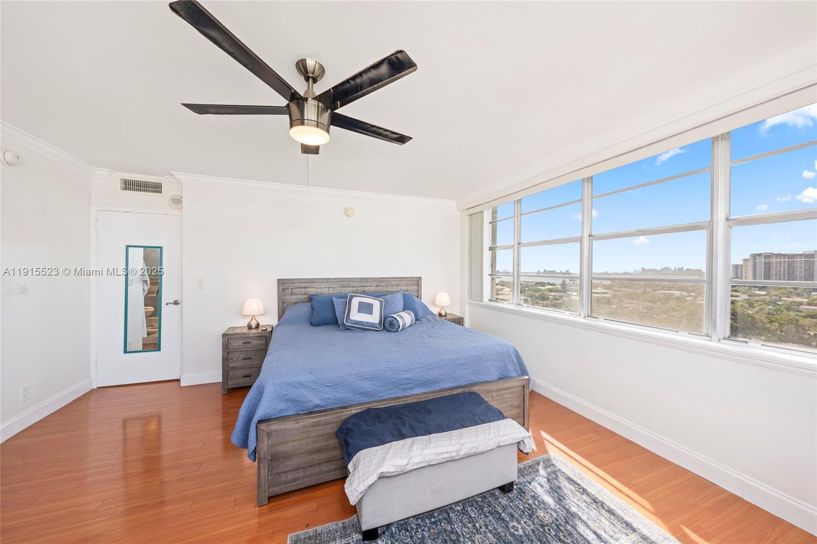 2100 Sans Souci Boulevard, Unit B1006 North Miami, FL 33181 - Photo 19 of 40 a bedroom with a bed and window