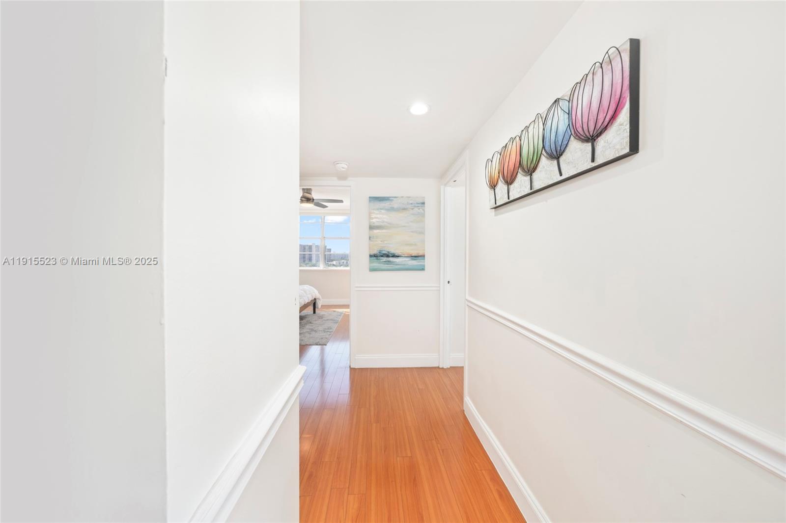 2100 Sans Souci Boulevard, Unit B1006 North Miami, FL 33181 - Photo 22 of 40 a view of a hallway with wooden floor