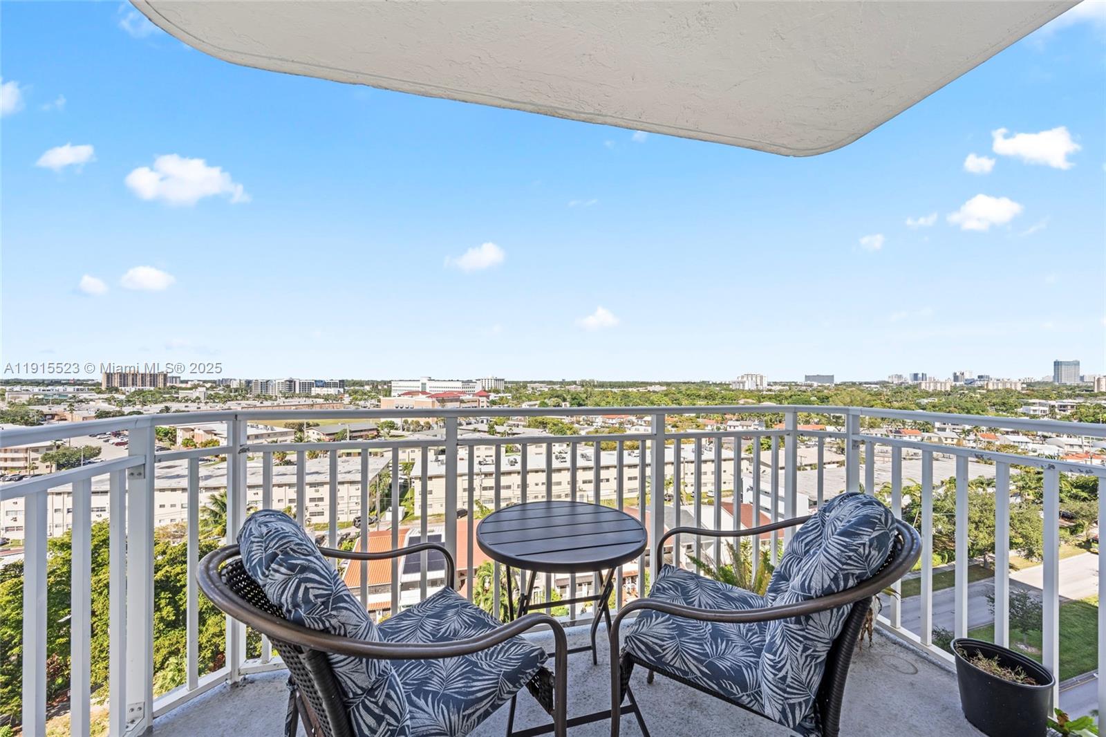2100 Sans Souci Boulevard, Unit B1006 North Miami, FL 33181 - Photo 9 of 40 a view of a balcony with furniture