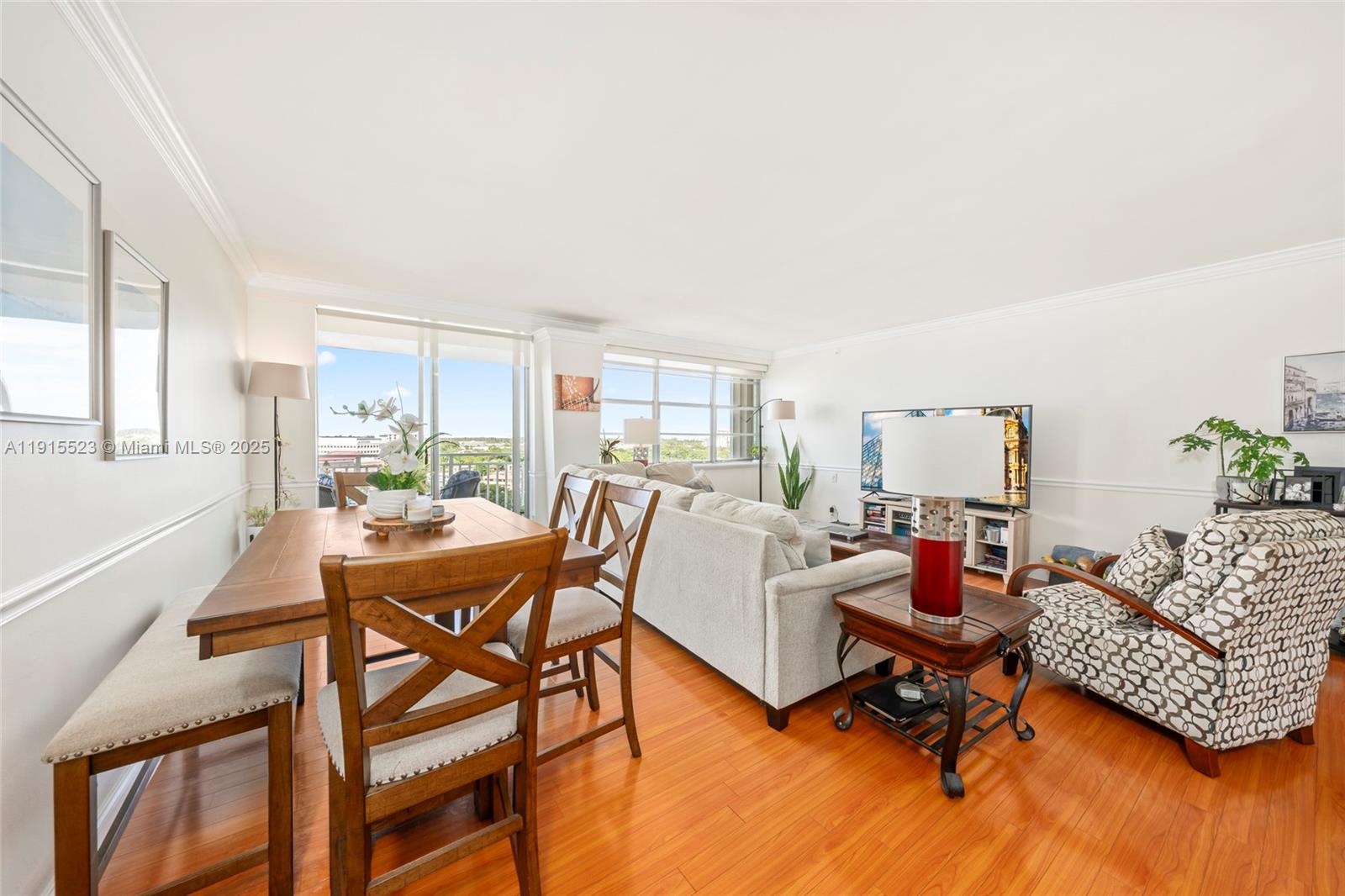 2100 Sans Souci Boulevard, Unit B1006 North Miami, FL 33181 - Photo 10 of 40 a living room with furniture and a wooden floor