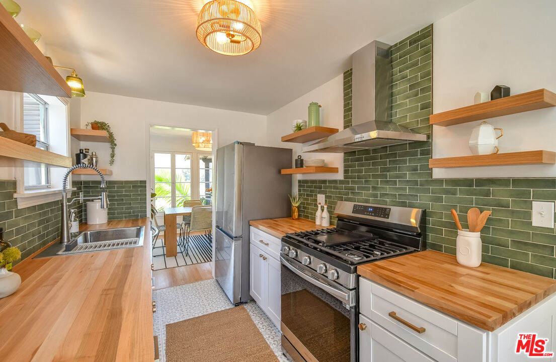 1817 Oak Tree Drive Los Angeles, CA 90041 - Photo 3 of 6 a stove top oven sitting inside of a kitchen