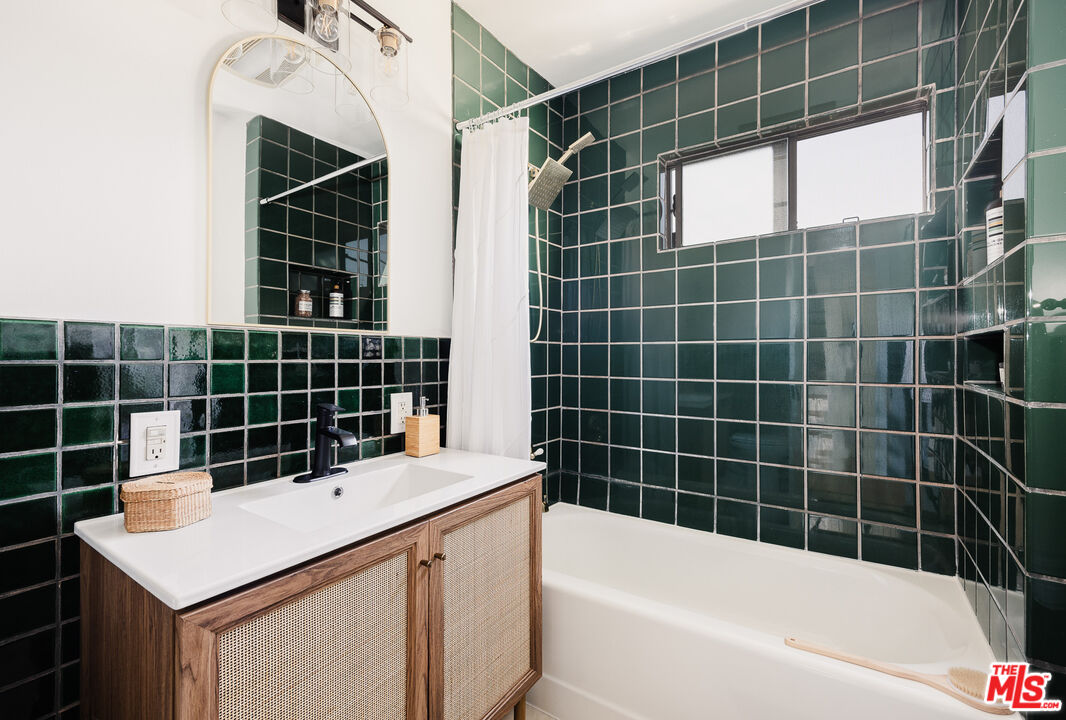 1817 Oak Tree Drive Los Angeles, CA 90041 - Photo 5 of 6 a bathroom with a sink a bathtub and shower