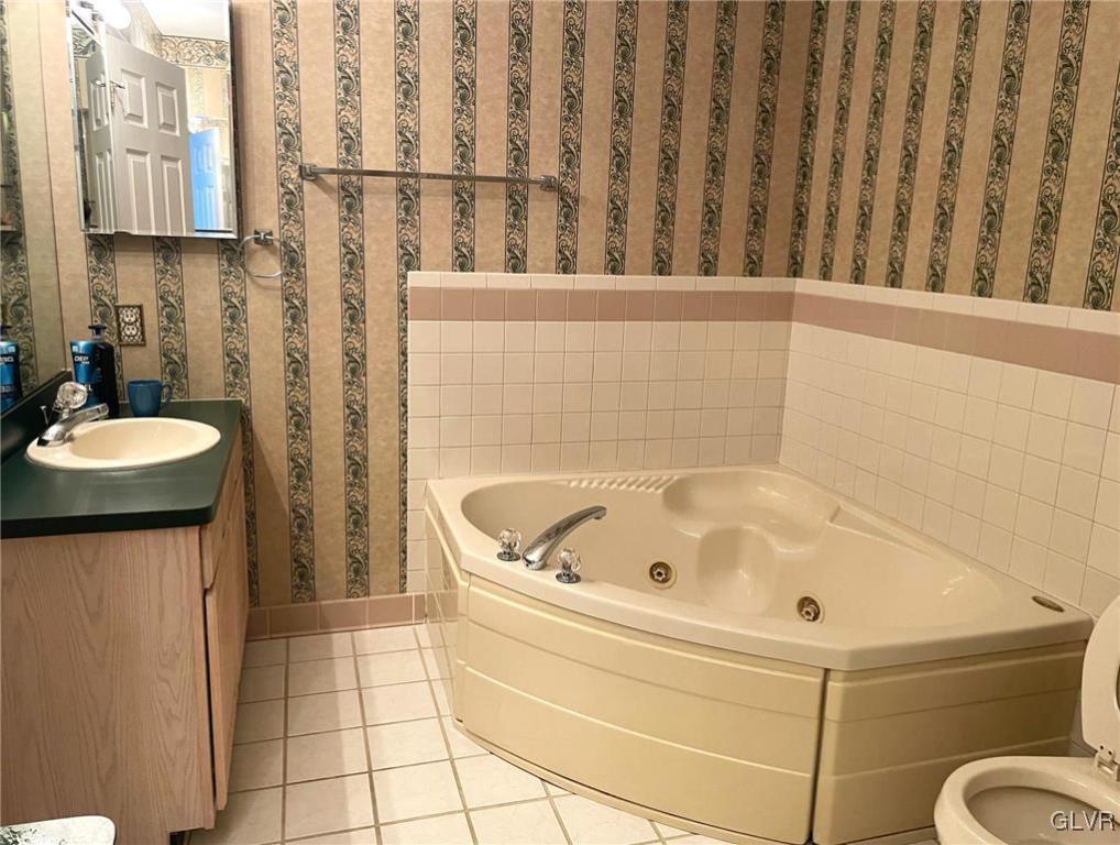 1690 Harding Circle Whitehall, PA 18052 - Photo 20 of 32 a bathroom with a tub a sink and a shower