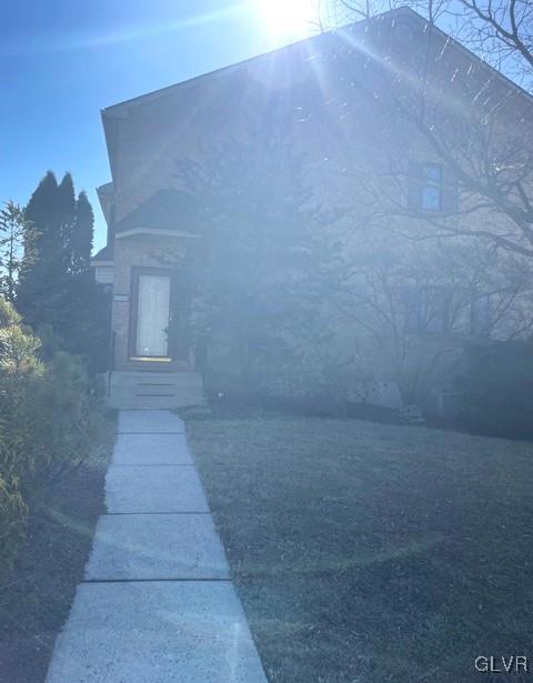1690 Harding Circle Whitehall, PA 18052 - Photo 2 of 32 a view of a big room with brick wall and entryway