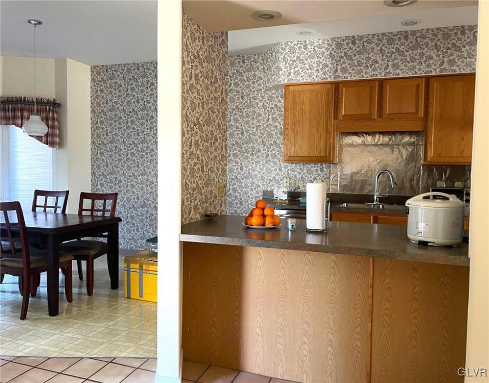 1690 Harding Circle Whitehall, PA 18052 - Photo 5 of 32 a kitchen with a sink and a refrigerator