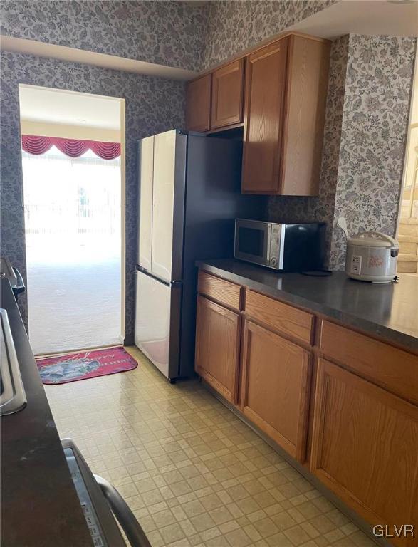 1690 Harding Circle Whitehall, PA 18052 - Photo 6 of 32 a kitchen with stainless steel appliances granite countertop a refrigerator and a sink