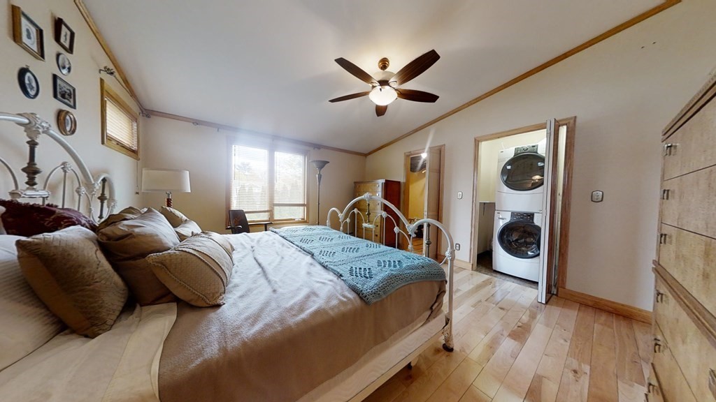 51 Miriam Road Waltham, MA 02451 - Photo 11 of 17 a bed room with a bed and a walk in closet
