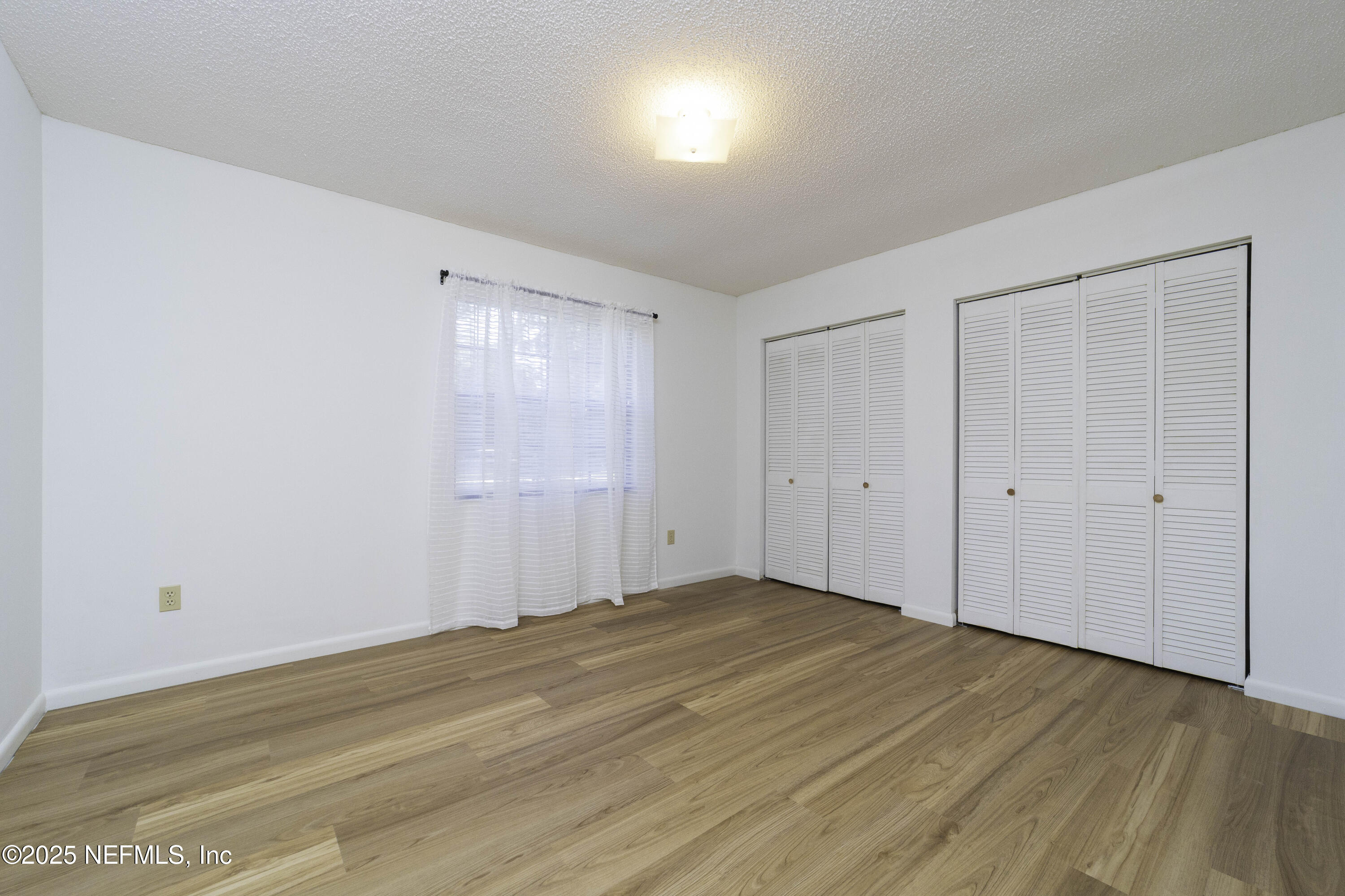 103 Indian Mound Road Satsuma, FL 32189 - Photo 23 of 36 a view of empty room with wooden floor
